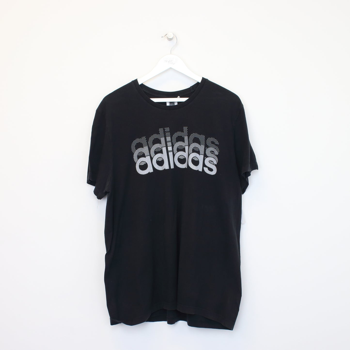 Vintage Adidas spell out T-Shirt in black. Best fits XL