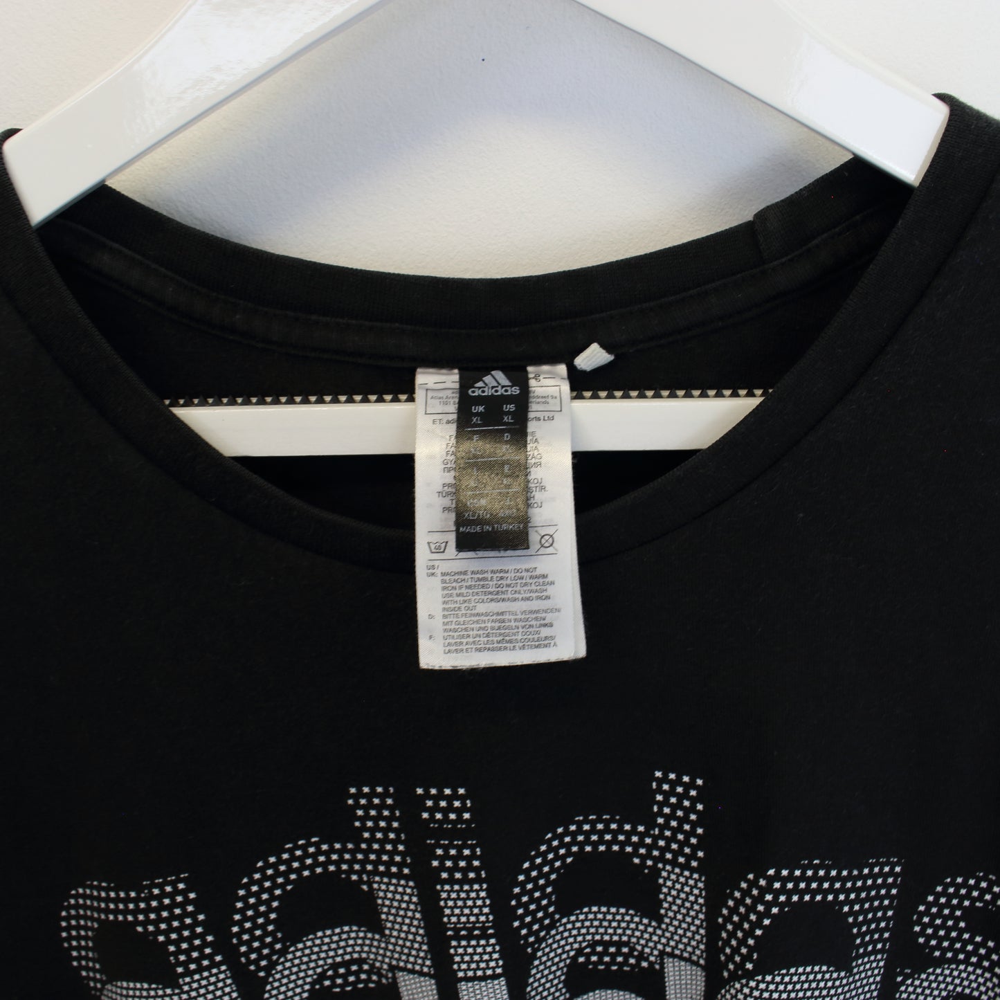 Vintage Adidas spell out T-Shirt in black. Best fits XL