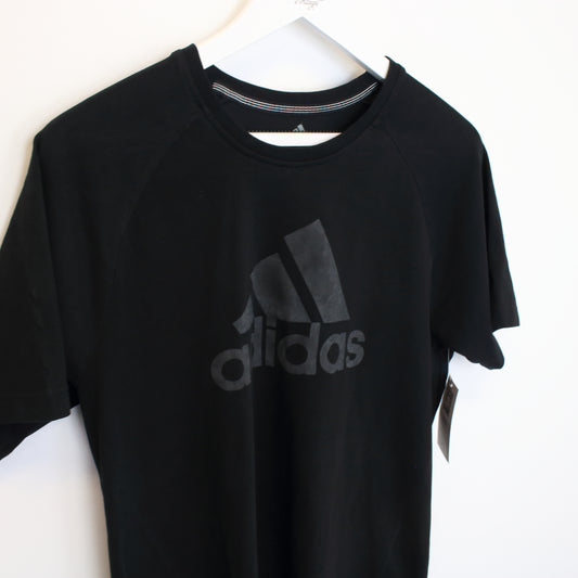 Vintage Adidas spell out T-Shirt in black. Best fits S