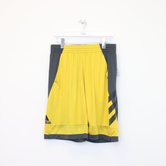 Vintage Adidas shorts in yellow and grey. Best fits XL