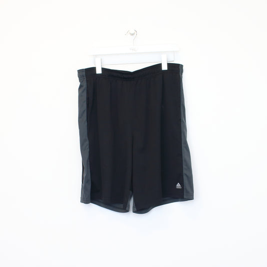 Vintage Adidas shorts in black and grey. Best fits XL