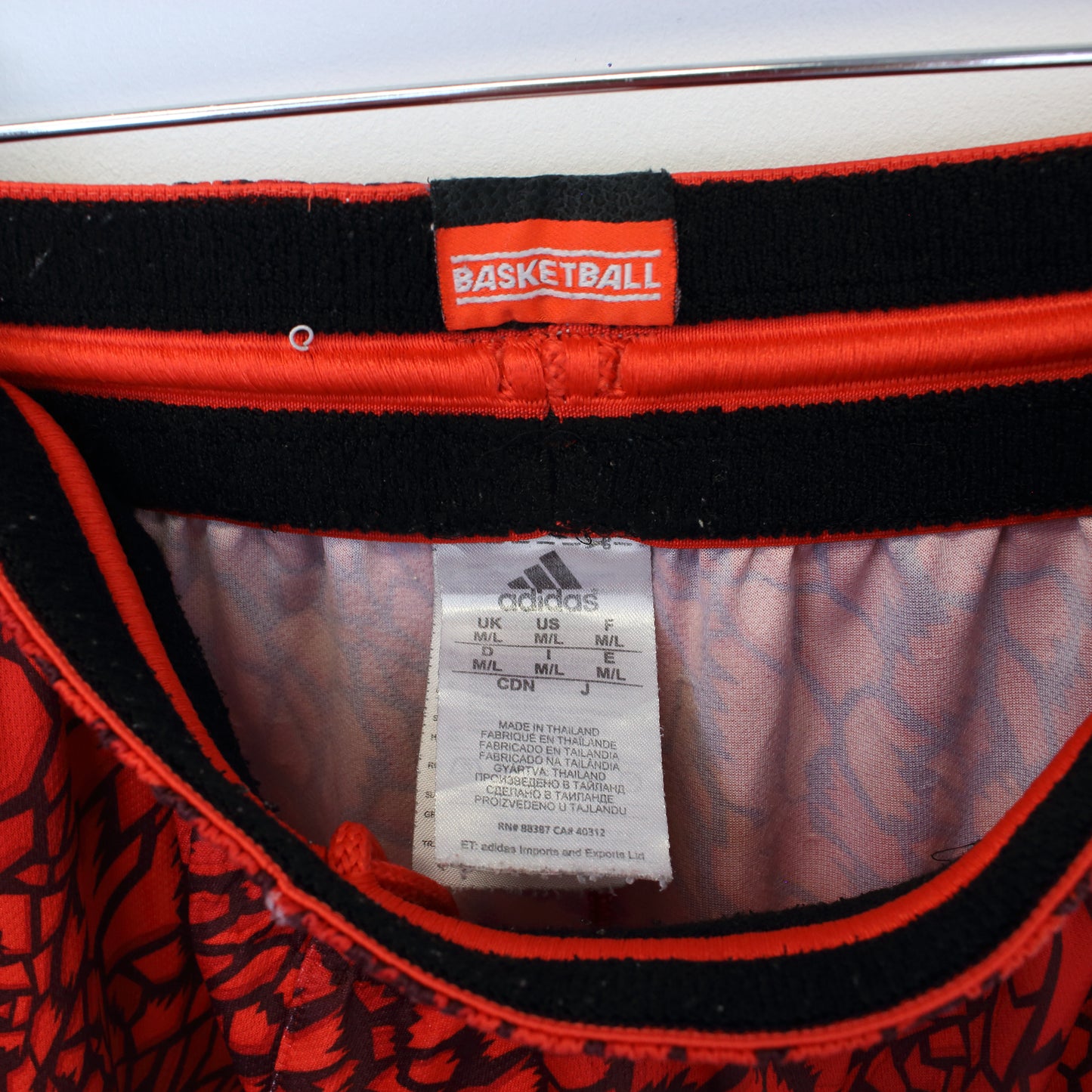 Vintage Adidas animal print shorts in red. Best fits M