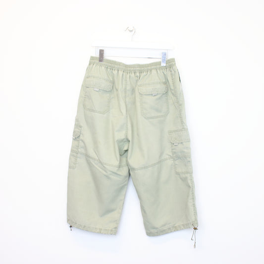 Vintage YUHA three quarter cargo shorts in green. Best fits 30