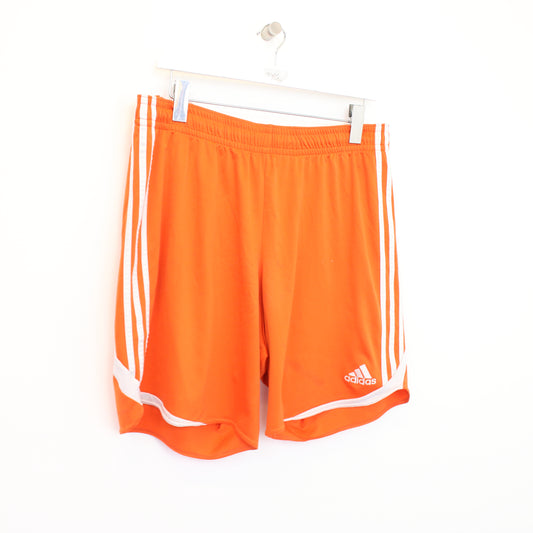 Vintage Adidas shorts in orange and white. Best fits XL