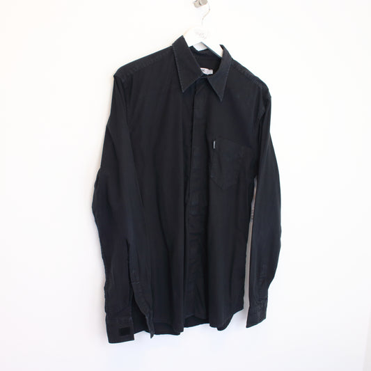 Vintage Moschino shirt in black. Best fits L