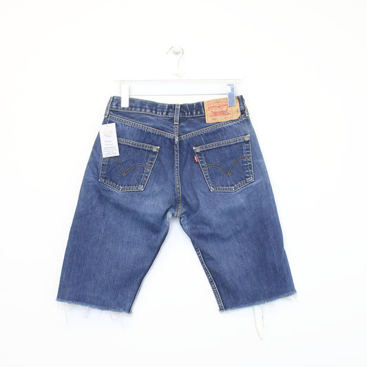 Vintage Levi's 501 cut off shorts in blue. Best fits 30