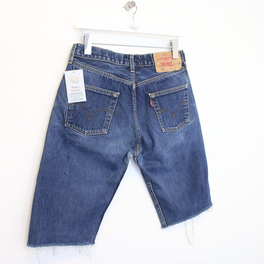 Vintage Levi's 501 cut off shorts in blue. Best fits 30