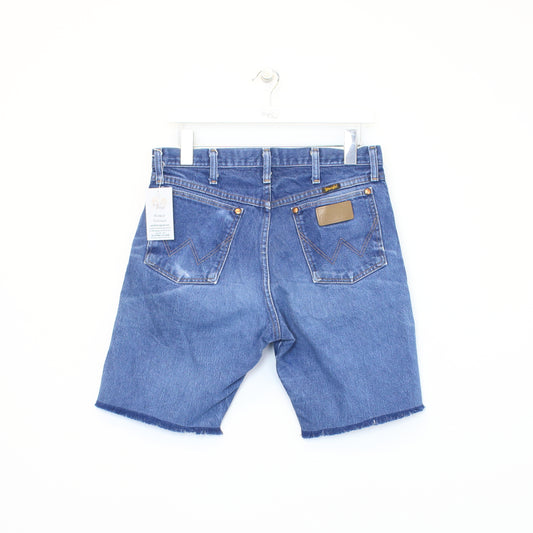Vintage Wrangler cut off shorts in blue. Best fits 31