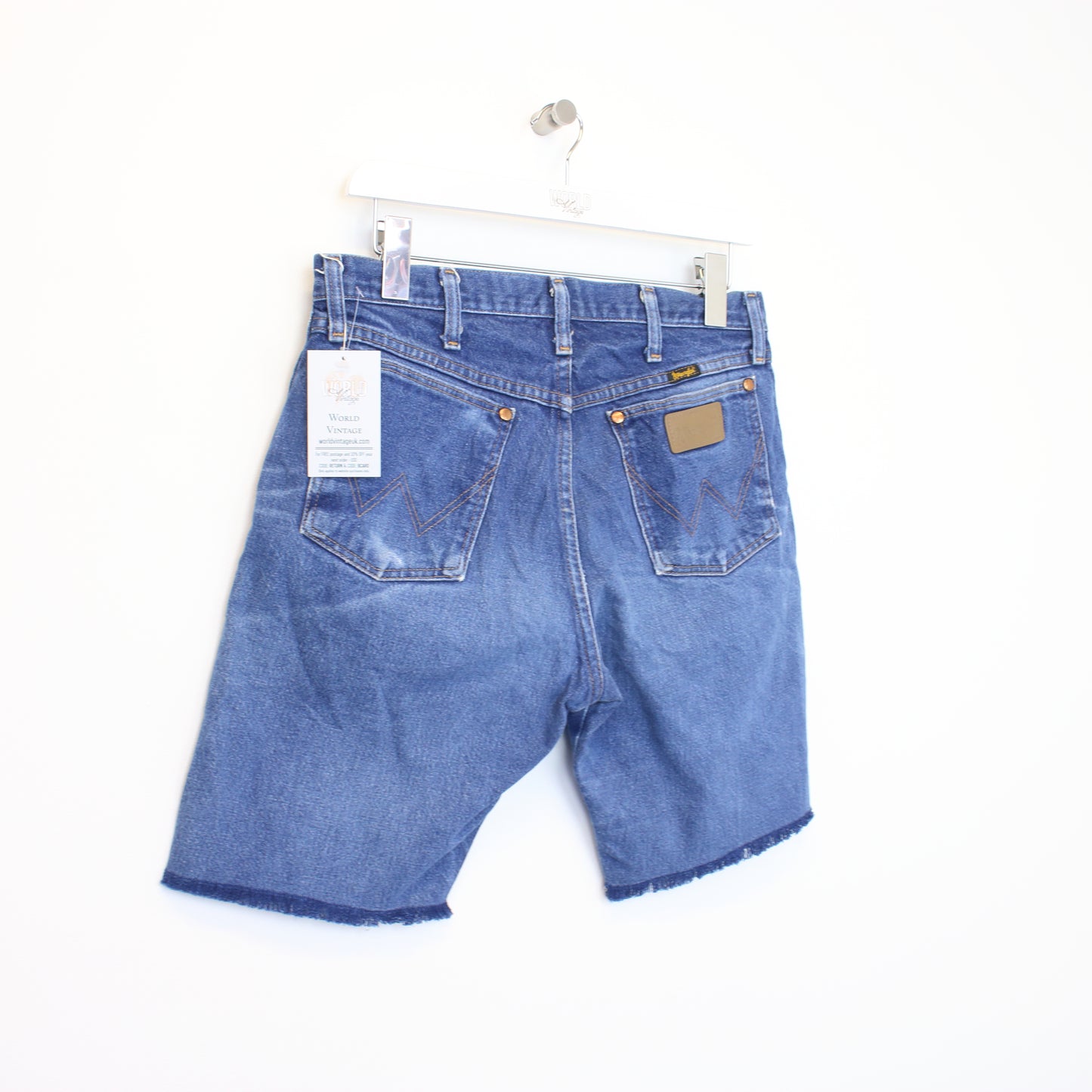 Vintage Wrangler cut off shorts in blue. Best fits 31