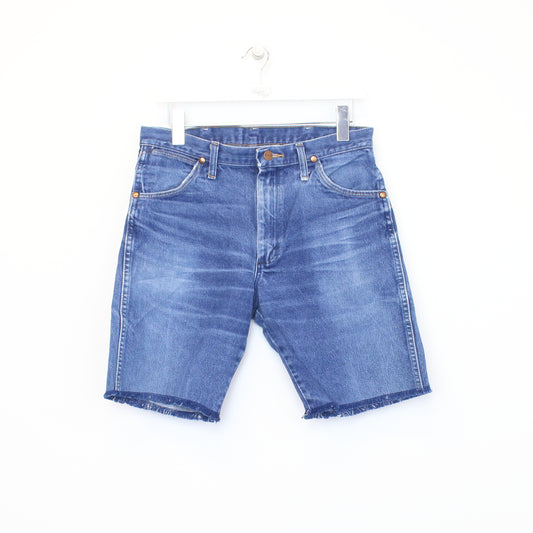 Vintage Wrangler cut off shorts in blue. Best fits 31