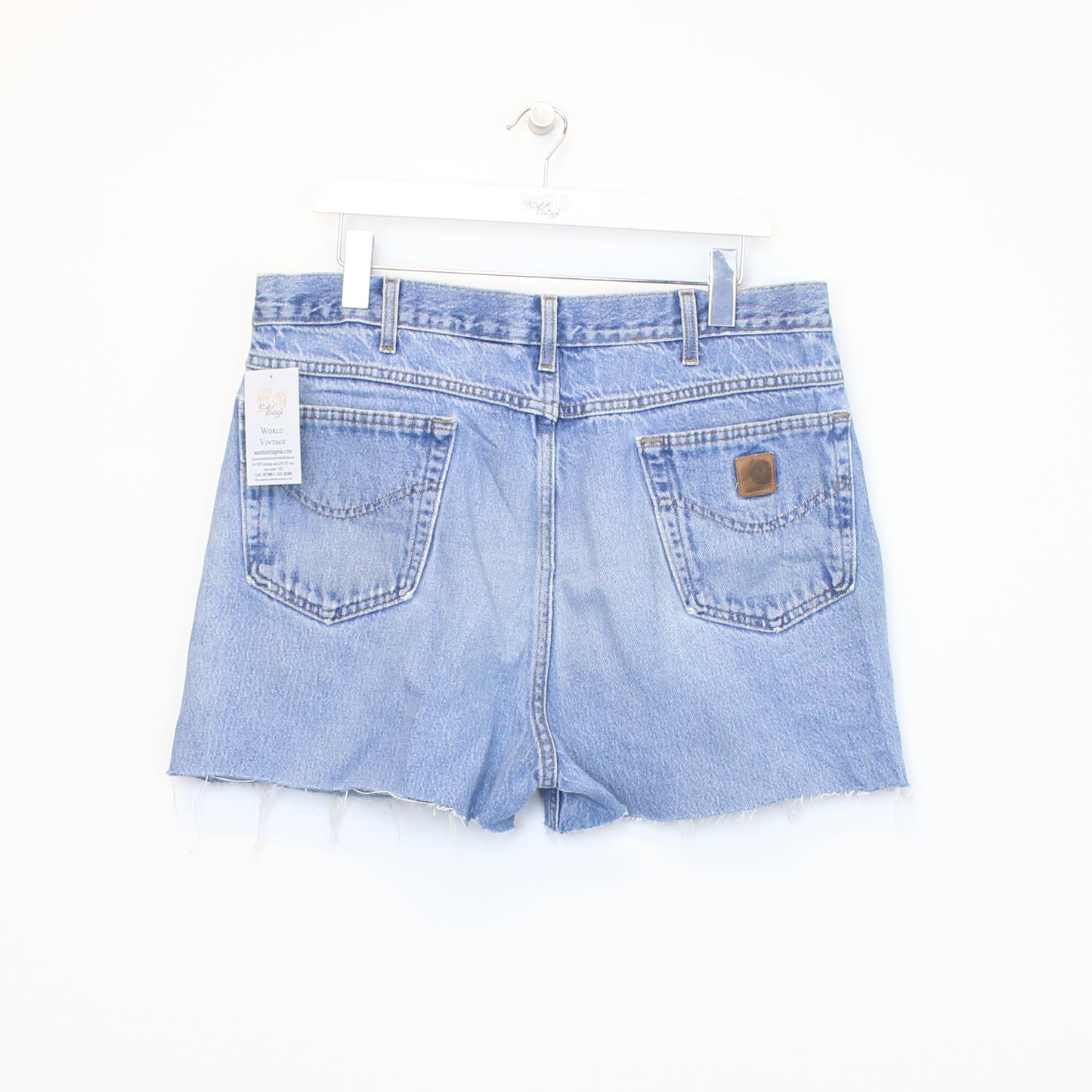 Vintage Women's Carhartt cut off shorts in blue. Best fits 35