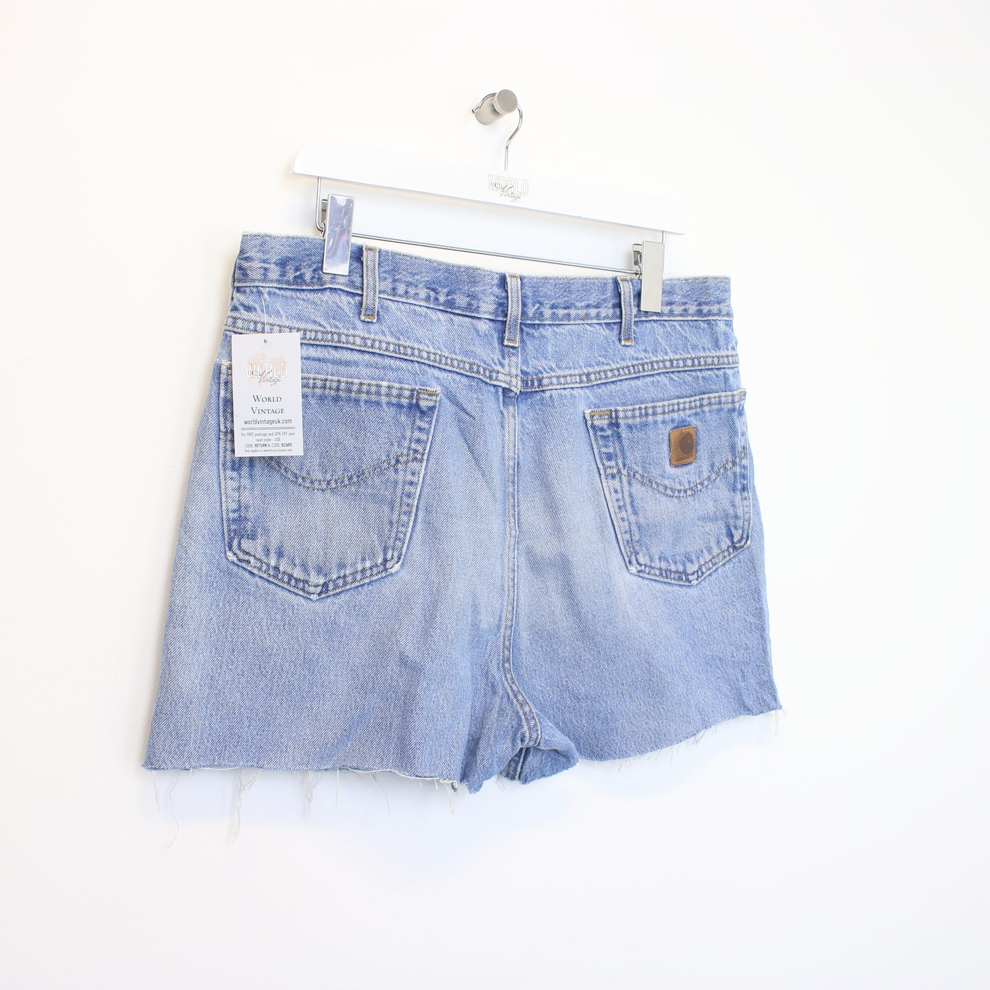 Vintage Women's Carhartt cut off shorts in blue. Best fits 35