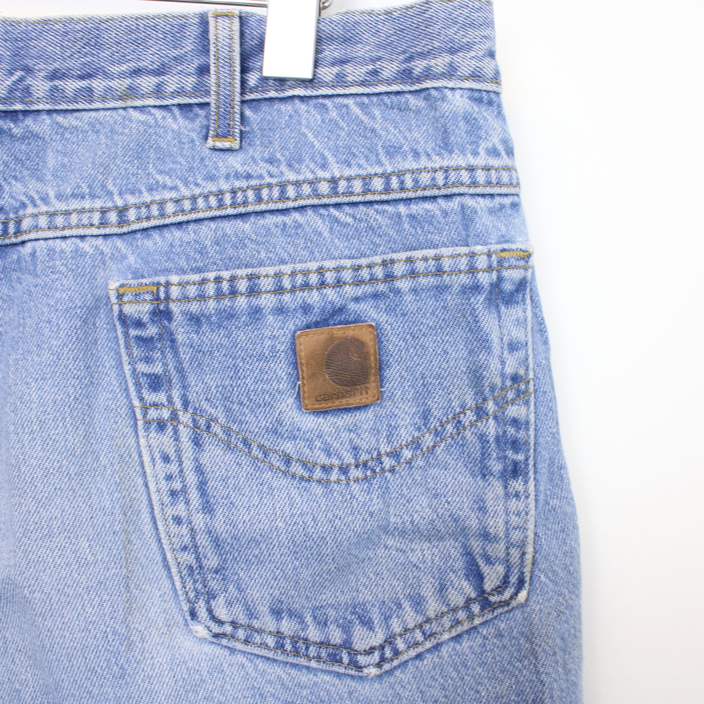 Vintage Women's Carhartt cut off shorts in blue. Best fits 35