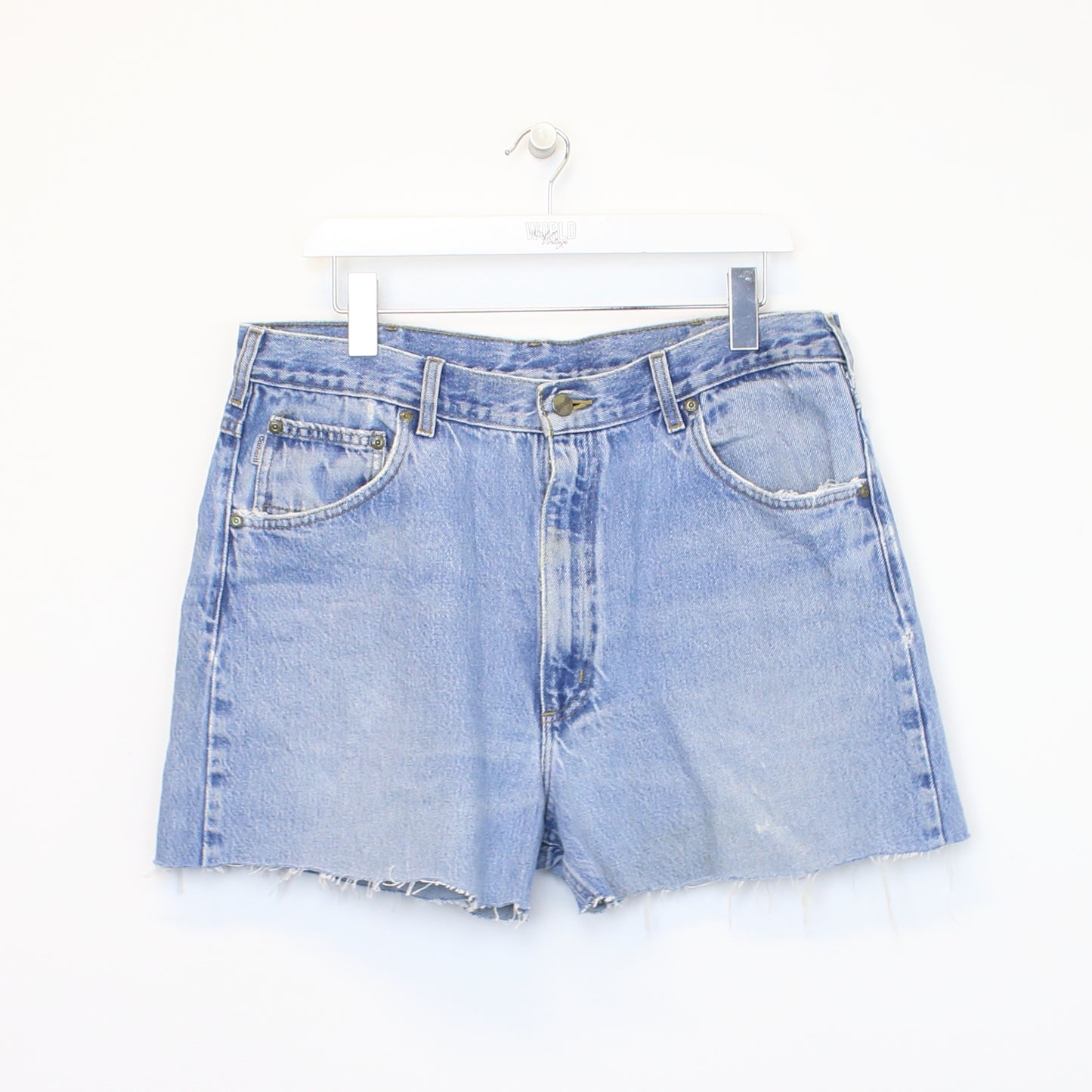 Vintage Women's Carhartt cut off shorts in blue. Best fits 35