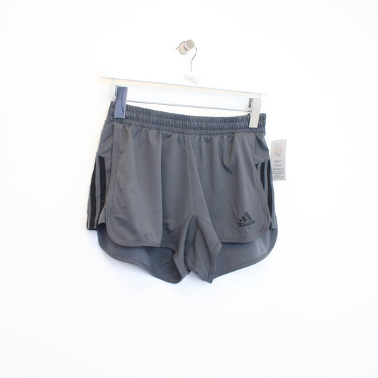 Vintage women's Adidas shorts in grey and black. Best fits S