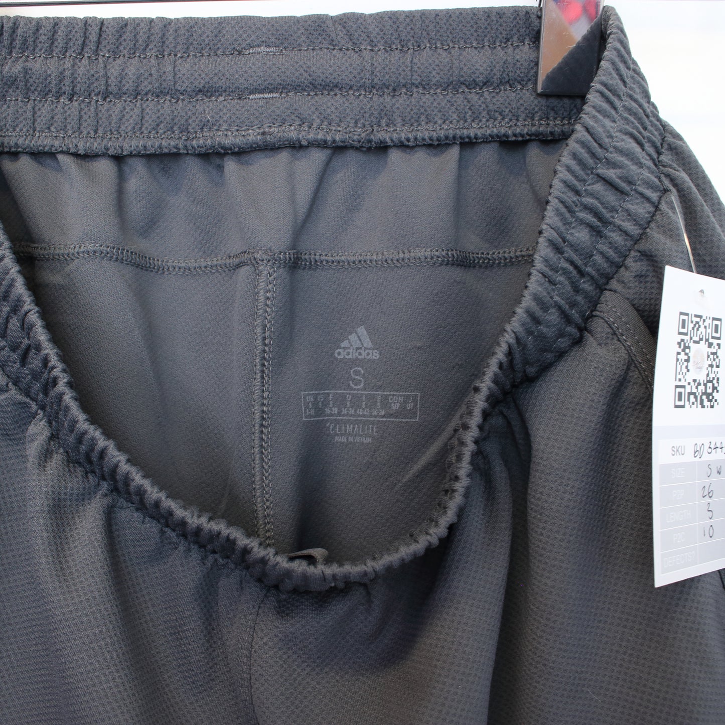 Vintage women's Adidas shorts in grey and black. Best fits S