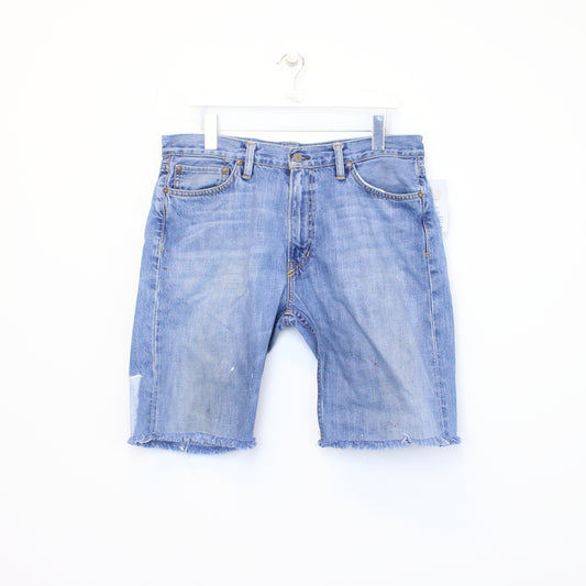 Vintage Ralph Lauren cut off shorts in blue. Best fits 35