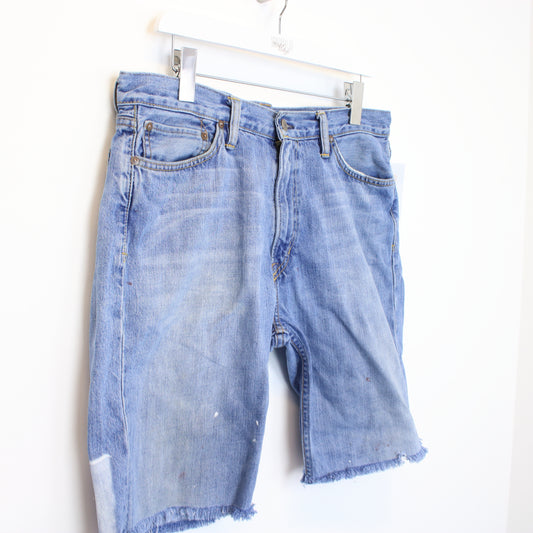 Vintage Ralph Lauren cut off shorts in blue. Best fits 35