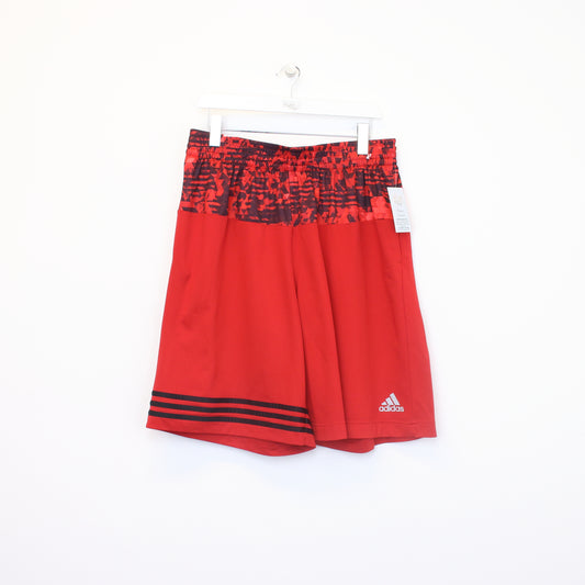 Vintage Adidas shorts in red and black. Best fits XL