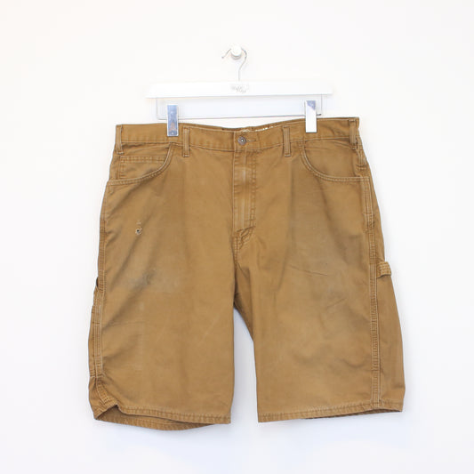 Vintage Carhartt carpenter shorts in tan. Best fits W37