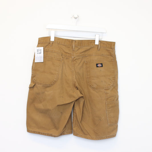 Vintage Carhartt carpenter shorts in tan. Best fits W37