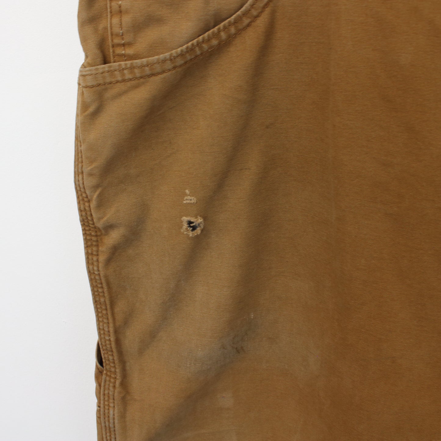 Vintage Carhartt carpenter shorts in tan. Best fits W37