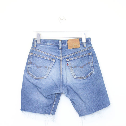 Vintage Levi's denim cut off shorts in blue. Best fits W28"