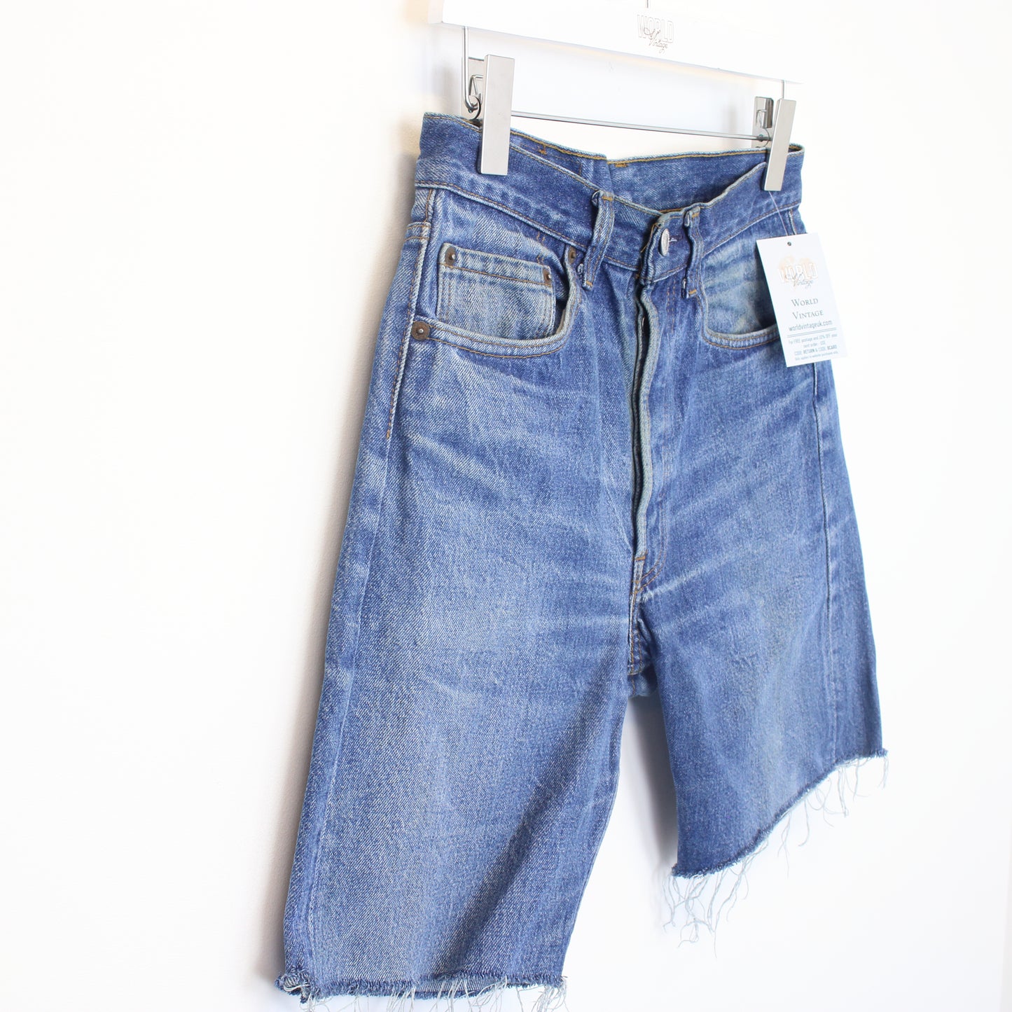 Vintage Levi's denim cut off shorts in blue. Best fits W28"