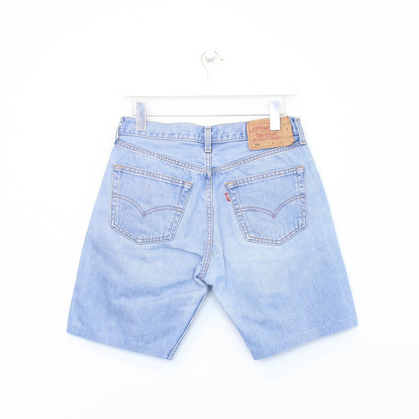 Vintage Levi's denim cut off shorts in blue. Best fits W29"