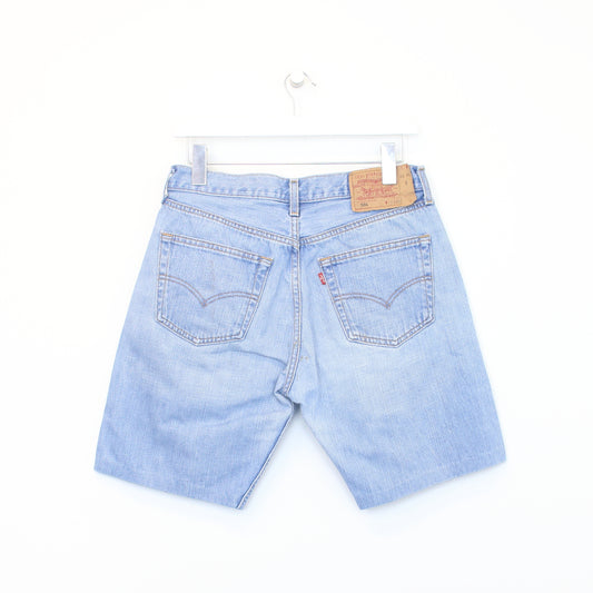 Vintage Levi's denim cut off shorts in blue. Best fits W29"