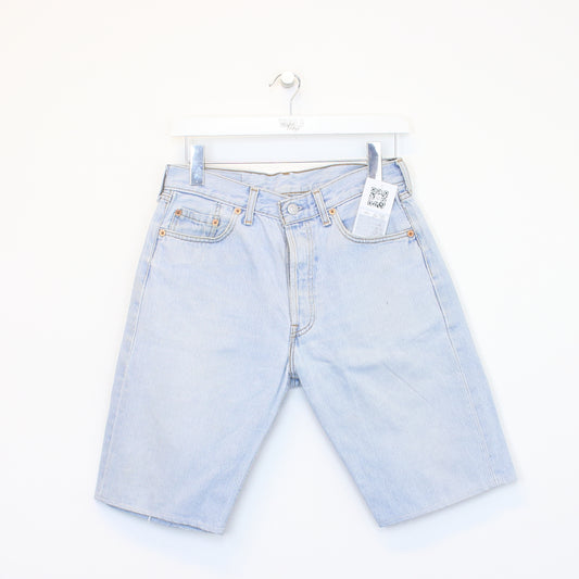 Vintage Levi's denim cut off shorts in blue. Best fits W28"