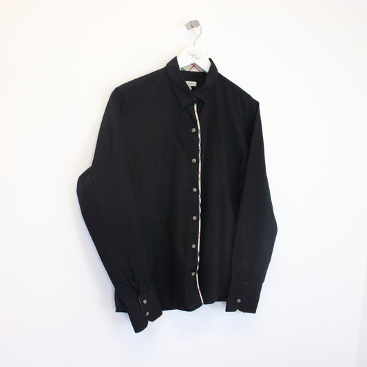 Vintage Women's Burberry shirt in black. Best fits S