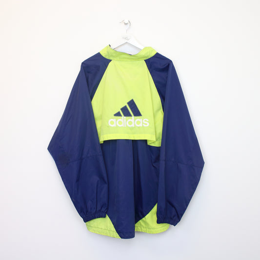 Vintage Adidas track jacket in blue and green. Best fits XL