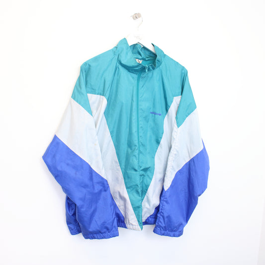 Vintage Adidas windbreaker jacket in blue and white. Best fits L