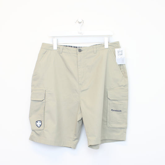 Vintage Reebok cargo shorts in beige. Best fits 35