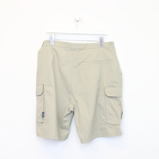 Vintage Reebok cargo shorts in beige. Best fits 35