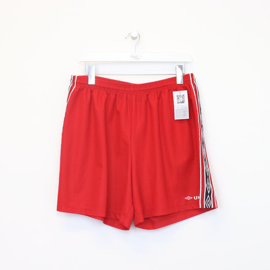 Vintage Umbro shorts in red. Best fits L