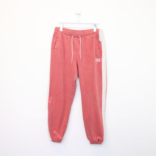 Vintage Nike joggers in pink and white. Best fits XL