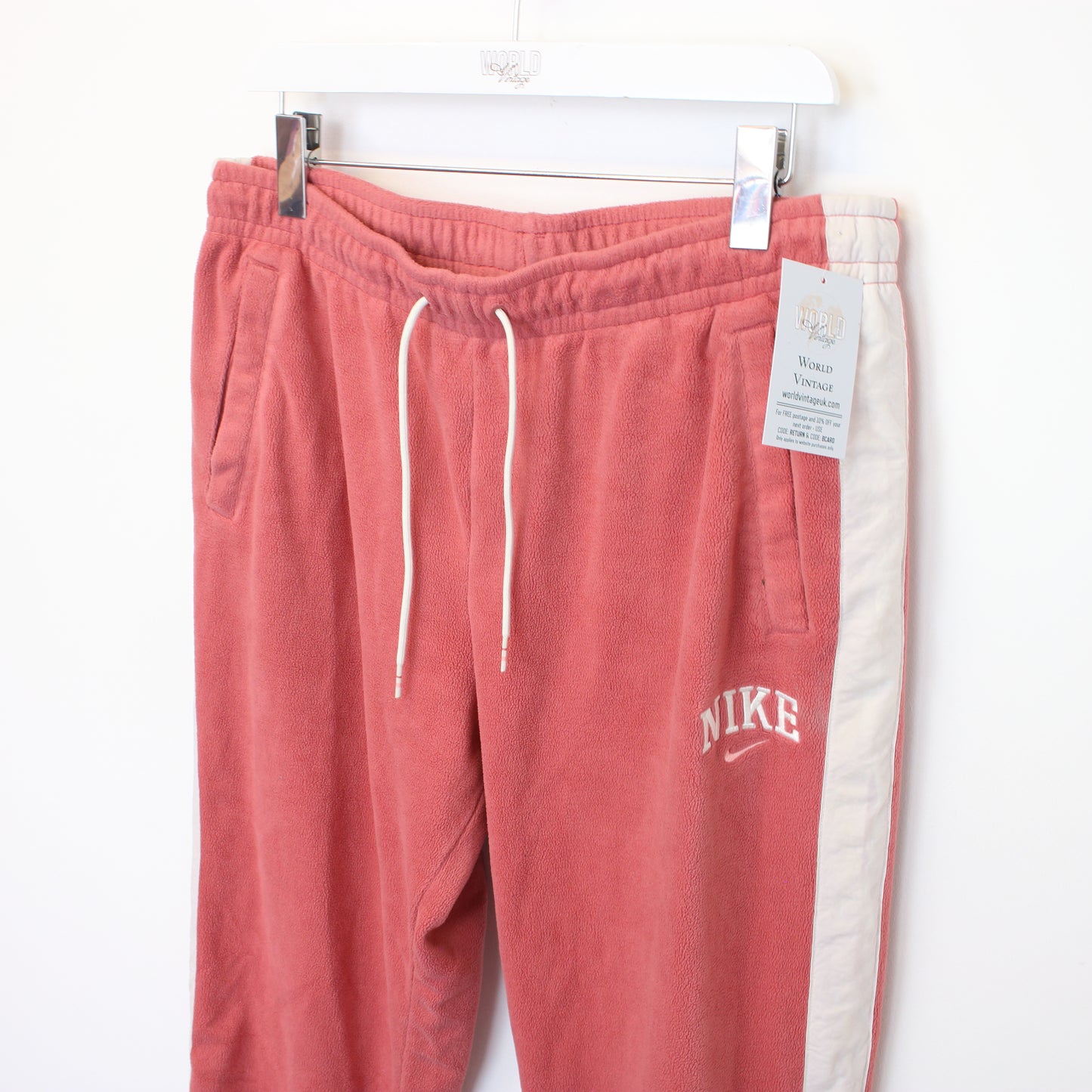 Vintage Nike joggers in pink and white. Best fits XL