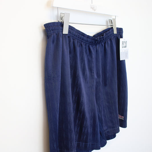 Vintage Umbro shorts in navy. Best fits L