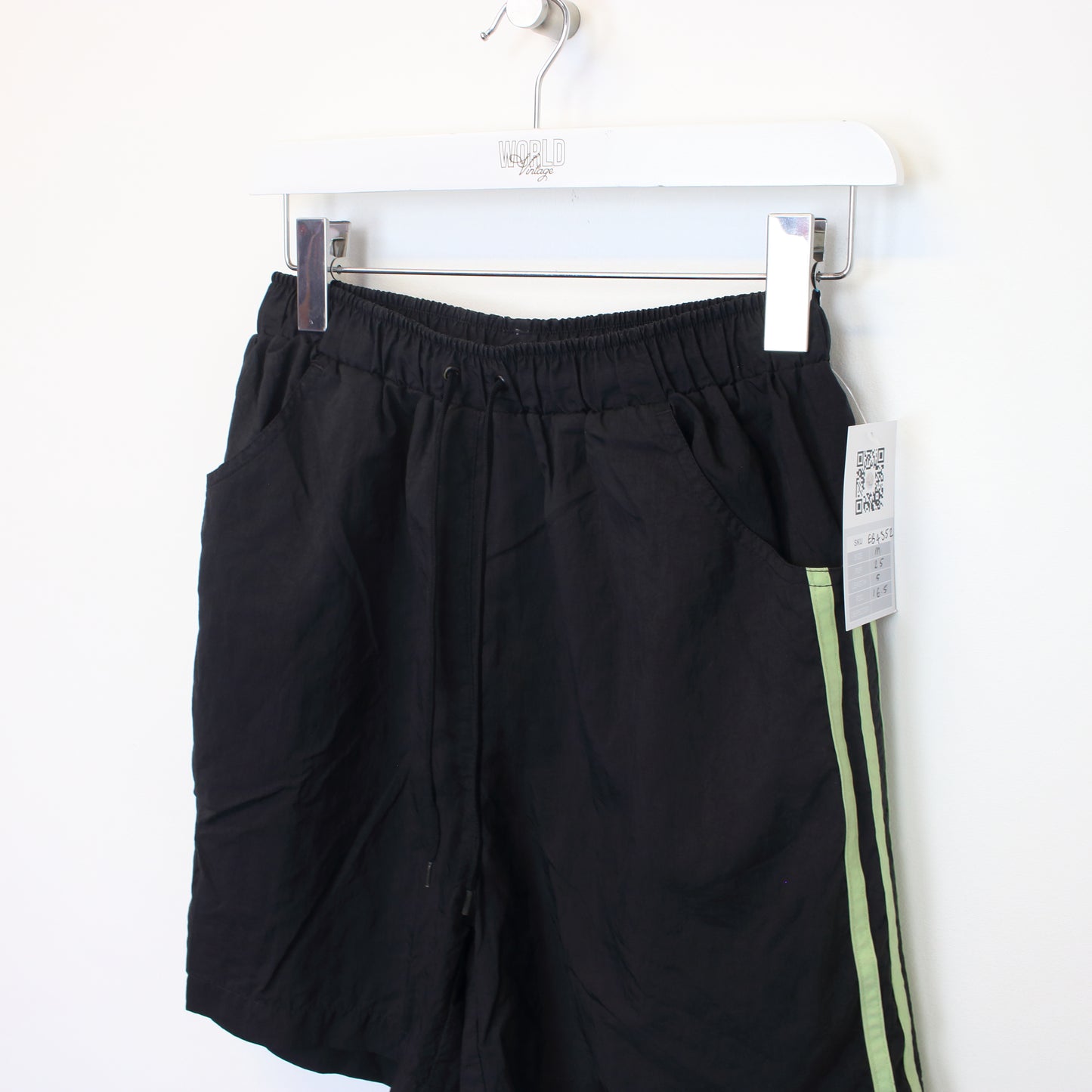 Vintage Adidas shorts in black and green. Best fits M