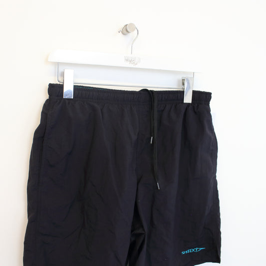 Vintage Speedo shorts in black. Best fits M