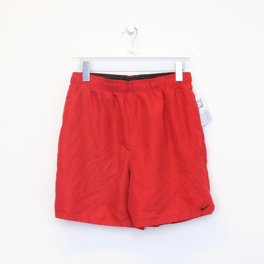 Vintage Nike shorts in red. Best fits M