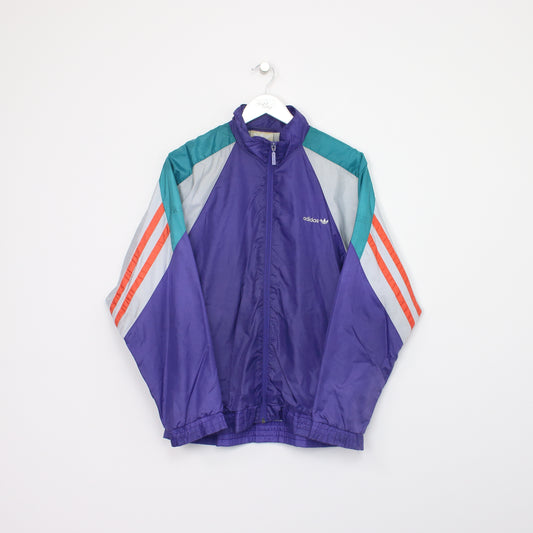 Vintage Adidas windbreaker jacket in multi colour. Best fits L