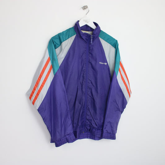 Vintage Adidas windbreaker jacket in multi colour. Best fits L