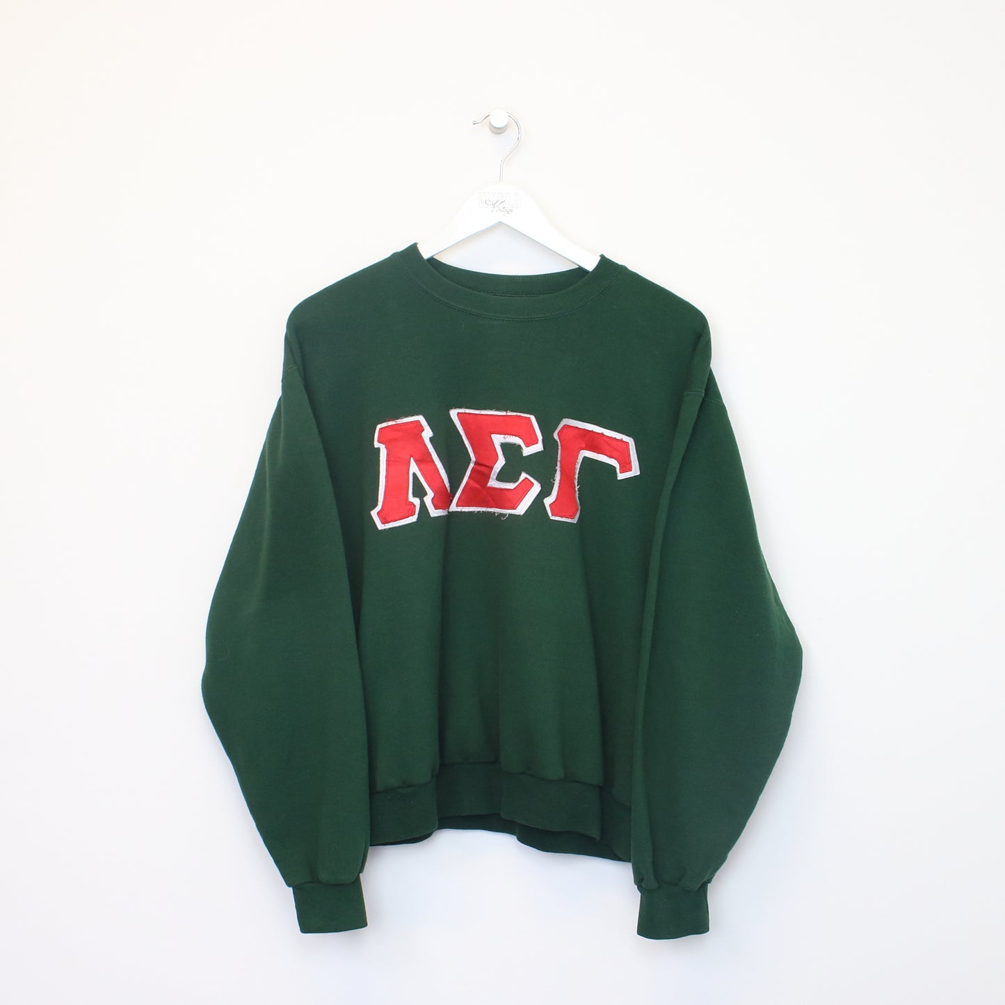 Vintage Jerzees college sweatshirt in green. Best fits S