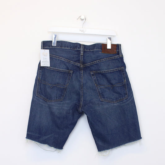 Vintage Polo Ralph Lauren cut off shorts in blue. Best fits 33