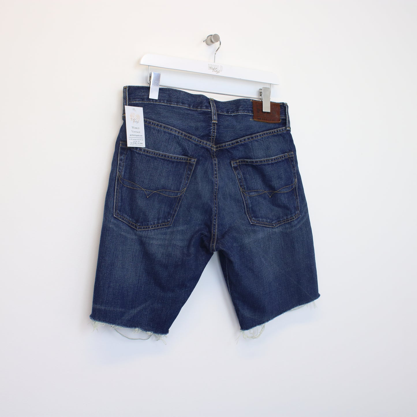 Vintage Polo Ralph Lauren cut off shorts in blue. Best fits 33