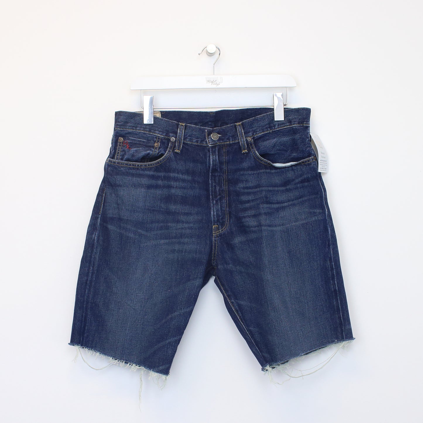 Vintage Polo Ralph Lauren cut off shorts in blue. Best fits 33