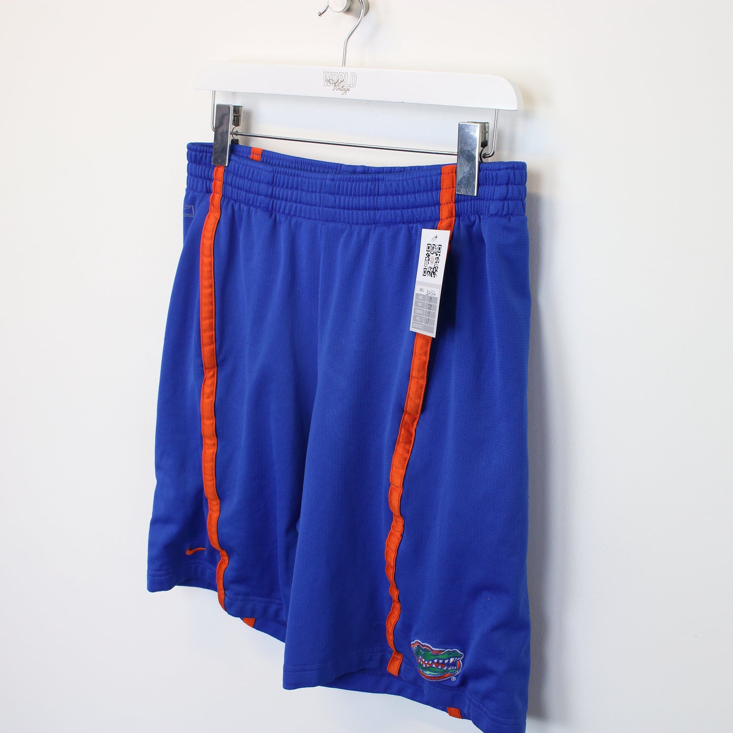 Vintage Nike shorts in blue and orange. Best fits M